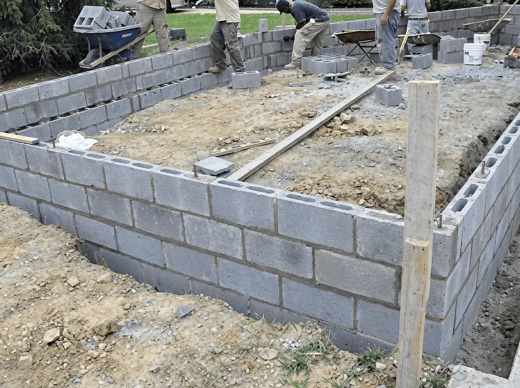 Professionals building a foundation with blocks in Gilbert, AZ